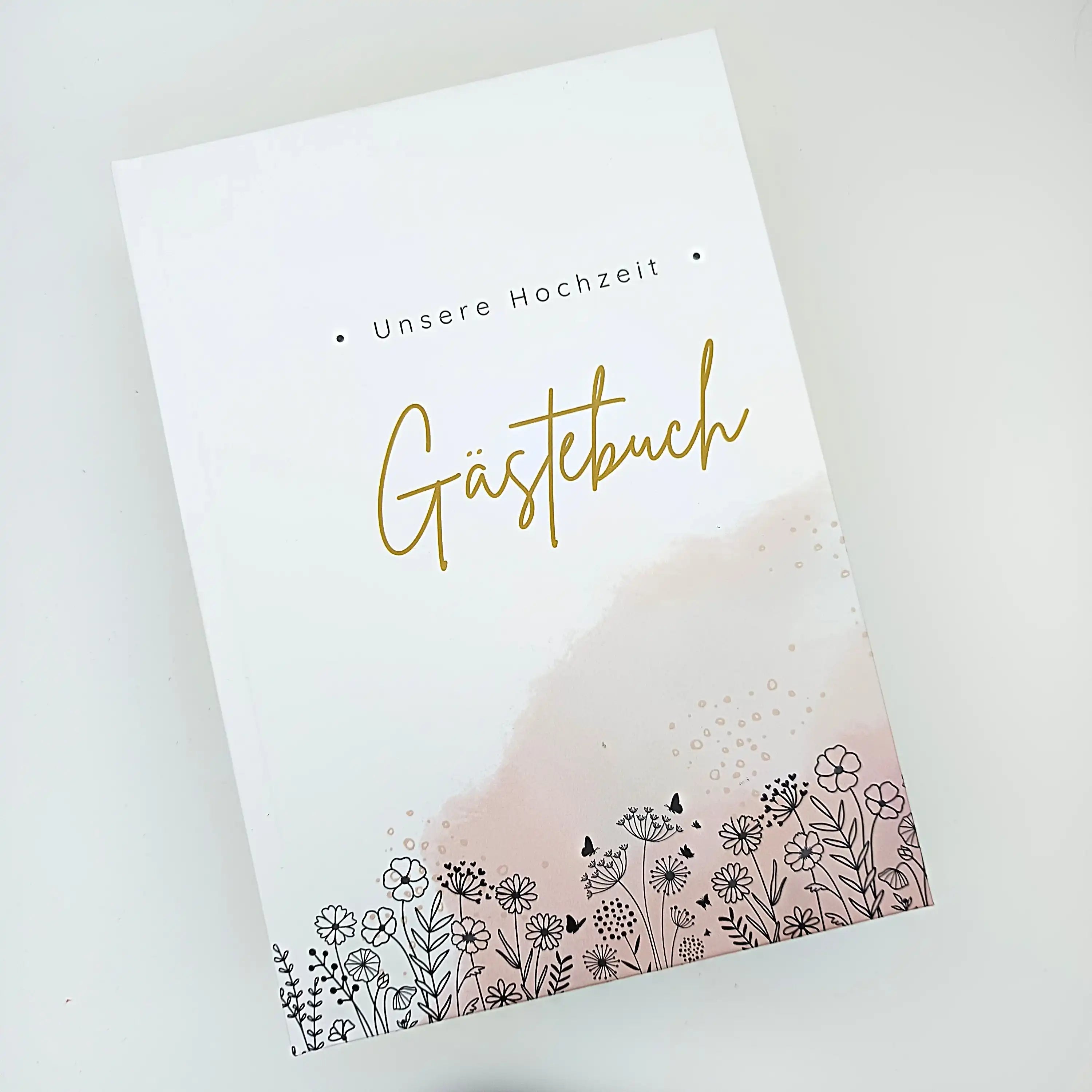 Hochzeits-Gästebuch mit Blumenmotiv, goldener Schrift und rosafarbenem Aquarell